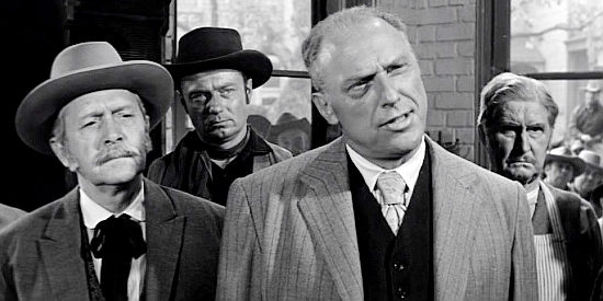 Howard Petrie as Mayor Harvey King, trying to convince bounty man Morg Hickman to leave town as soon as possible in The Tin Star (1957)