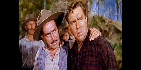 J. Carroll Naish as Gil Harkness, consoling Jim Vesser (Edmond O'Brien) after an accidental death in The Denver and Rio Grande (1952)