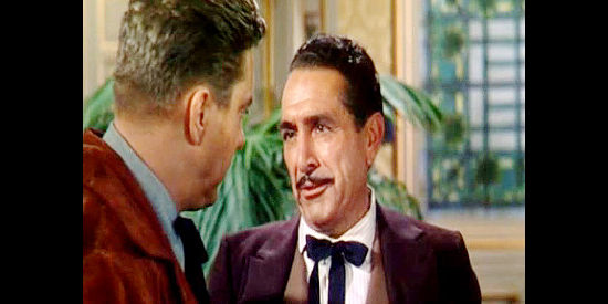J. Carroll Naish as Gil Harkness, trying to convince Jim Vesser to return to his job as railroad crew boss in The Denver and Rio Grande (1952)
