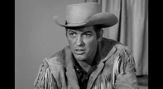 James Brown as Wayne Santley, trying to convince Norah Blaine to accompany him to Jackson Hole in Gun Fight (1961)