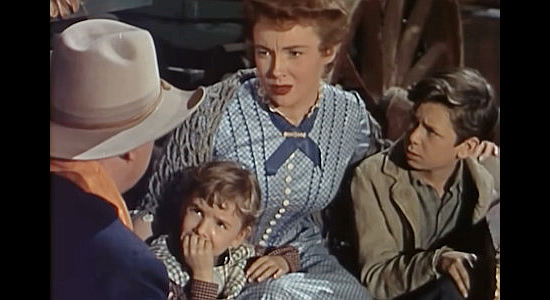 Joan Leslie as Mary Kimber, being advised to flee an Indian attack with the Billings children, Jesse (Nadine Ashdown) and Davey (Robert Hyatt) in Toughest Man in Arizona (1952)