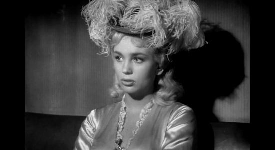 Joan Staley as Norah Blaine, finding herself on a stage with a self-proclaimed protector and an ex-cavalryman who hasn't been around a woman for eight months in Gun Fight (1961)