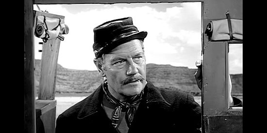 Joel McCrea as Trooper Hook checks on the stage passengers in Trooper Hook (1957)