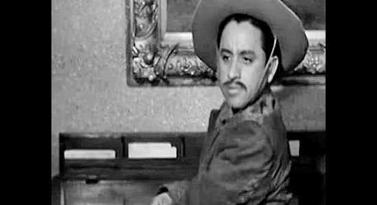 Jose Gonzalez-Gonzalez as El Raton, watching the Wild Bunch make a large bank deposit in The Three Outlaws (1956)