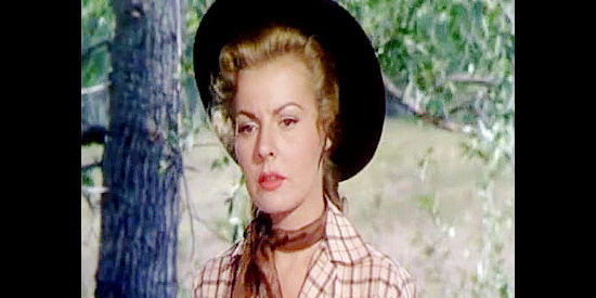 Kasey Rogers as Linda Prescott, coming across two victims of Jim Vesser's six-gun in The Denver and Rio Grande (1952)