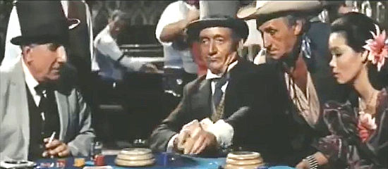 Olivier Hussenot as the judge places a bet in Gunmen of the Rio Grande (1964)