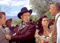 Skip Homeier as Howie Stewart, Richard Boone as Wick Campbell, Donna Martell as Maria Segura and Randolph Scott as John Stewart in Ten Wanted Men (1955)