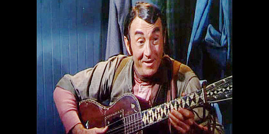 Paul Fix as Monyhan, a railroad engineer romancing Jane with the help of his guitar in The Denver and Rio Grande (1952)