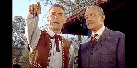 Randolph Scott as John Stewart, pointing out his cattle empire to attorney brother Adam Stewart (Lester Matthews) in Ten Wanted Men (1955)