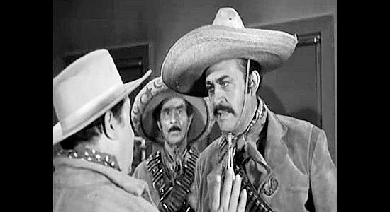 Rodolfo Hoyos as El Gallo, the Mexican bandits whose men steal the Wild Bunch's money in The Three Outlaws (1956)