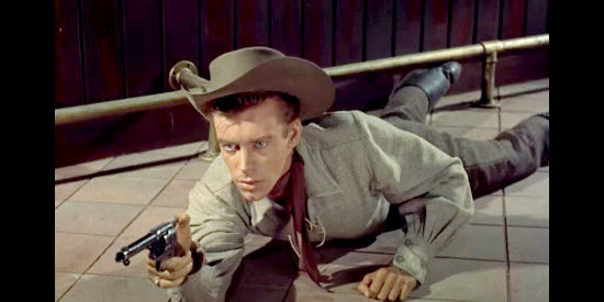 Skip Homeier as Howie Stewart, a young man forced to pick up a gun to defend himself in Ten Wanted Men (1955)