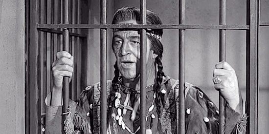 Ted de Corsia as Chief Buffalo Horn, in jail and about to stand trial for murder in Oklahoma Territory (1960)