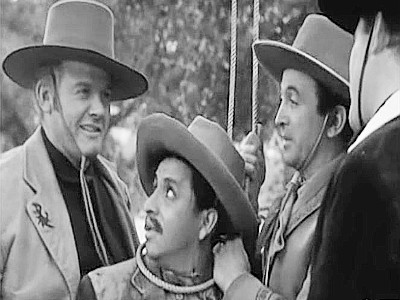 The Wild Bunch, including Sundance Kid (Alan Hale Jr.) and Bill Carver (Robert Christopher) putting El Raton (Jose Gonzales-Gonzales) in a bind in The Three Outlaws (1956)