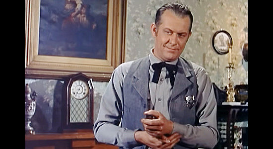 Vaughn Monroe as Matt Landry, planning a way to smuggle prisoner Frank Girard out of town in Toughest Man in Arizona (1952)
