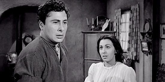 Victor Millan as Jose Miranda, listening to his wife Rosa (Ann Varela) in Terror in a Texas Town (1958)