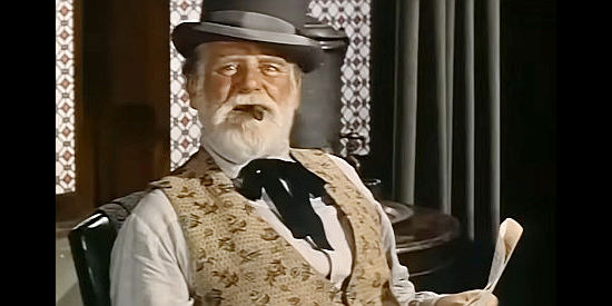 Wallace Ford as businessman Hal Stiles, conspiring to acquire the Warren mine in Thunder Over Arizona (1956)