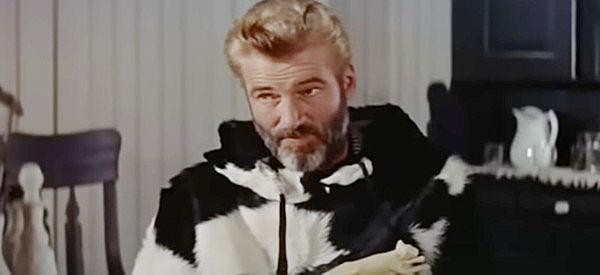 William Hopper as Arthur Bridges, holding a carving of a cat like the one he'll be tracking in Track of the Cat (1954)