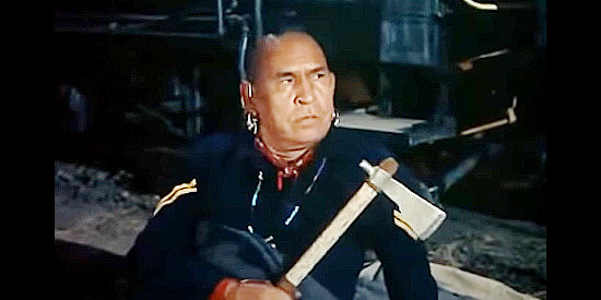 Chief Yowalachie as Pawnee, keeping a close eye on Kit, tomahawk in hand, in A Ticket to Tomahawk (1950)