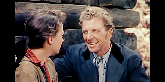 Dan Dailey as Johnny Behind the Deuces, a traveling salesman getting to know Kit better in A Ticket to Tomahawk (1950)