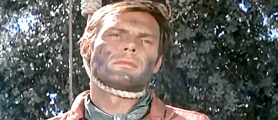 Adam West as ranger Sam Garrett, in a tight spot in The Relentless Four (1965)
