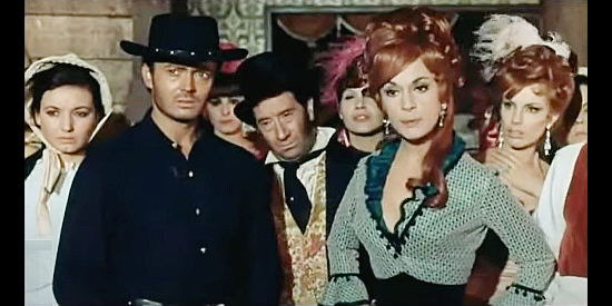 Adriana Ambesi as saloon girl Rosie, flanked by Vassili Karis as Danny, her protector in A Stranger in Paso Bravo (1968)