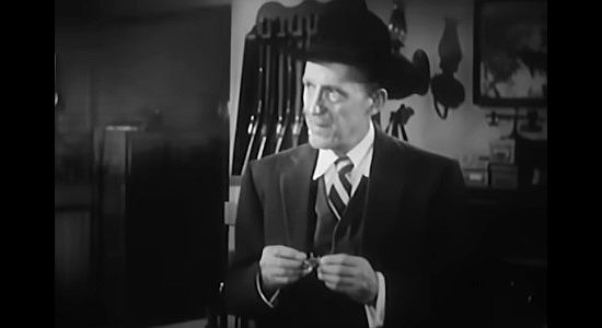 Alexander Lockwood as Bert, the man left holding the sheriff's badge when Caleb Whales in fired in Hell Canyon Outlaws (1957)