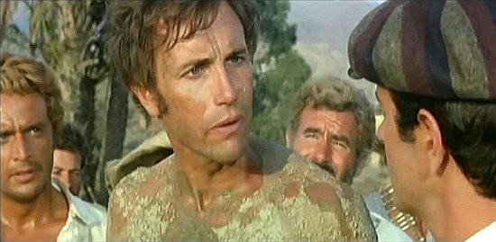 Anthony Steffen as Gringo after being rescued by Brown (Mark Damon) in Train for Durango (1968)