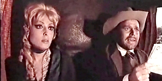 Banker Fred Mulligan (Renato Romano) offers a tidy sum to kill Durango as his fiance (Dada Gallotti) looks on in Shotgun (1968)