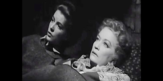 Barbara Bates as Piney and Miriam Hopkins as The Duchess, wondering how long it takes to starve in The Outcasts of Poker Flat (1952)