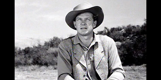 Bill Williams as Clay Halliday, the son eager to follow in his father's footsteps in The Halliday Brand (1957)