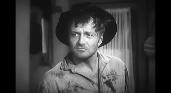 Brian Keith as Happy Waters, leading of a gang of outlaws who terrorize Gold Ridge in Hell Canyon Outlaws (1957)
