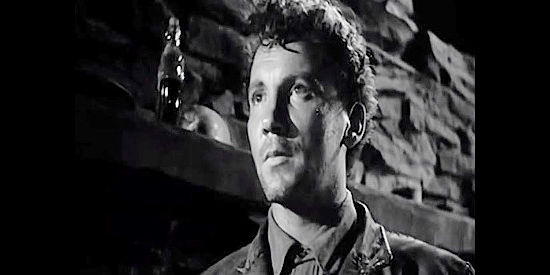 Cameron Mitchell as Ryker, the outlaw who finds his woman and his stolen loot trapped in a blizzard in The Outcasts of Poker Flat (1952)