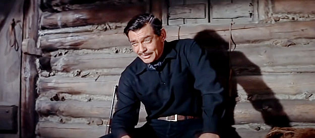 Clark Gable as Ben Allison, sharing his dream of starting a ranch on Prairie Dog Creek with Nella in The Tall Men (1955)