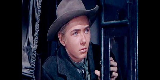 Claude Jarman Jr. as Roy Gort, the brother of Jen Gort's late husband, eager to prove he's a man in The Outriders (1950)