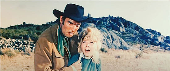 Claudio Undari (Robert Hundar) as Billly, threatening to harm Irene (Maria Silva) if he doesn't get information about Zorro in The Shadow of Zorro (1962)