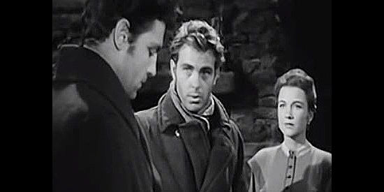 Craig Hill as Tom Dakin (center), planning to walk to town for help in The Outcasts of Poker Flat (1952)