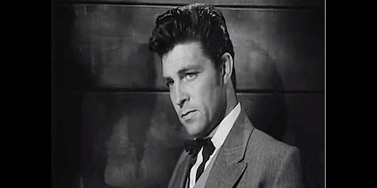 Dale Robertson as John Oakhurst, the loner who finds himself trying to help a motley group survive a blizzard in The Outcasts of Poker Flat (1952)