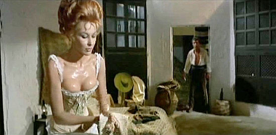Dominique Boschero as Helena tempting Manuel Zarzo as Heraclio in Train for Durango (1968)