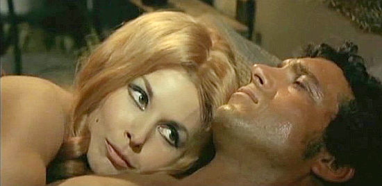 Dominique Boshero as Helena uses some bedroom persuasions on Heraclio (Manuel Zarzo) in Train for Durango (1968)