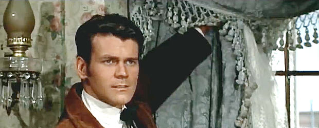 Don Murray as Lat Evans, getting a good look at the beating Callie has taken from Jehu in These Thousand Hills (1959)