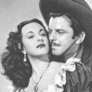 Estelita Rodriguez as Estelita Del Rey and John Carroll as Johnny Morrell in Old Los Angeles (1948)