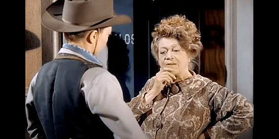 Esther Howard as saloon madam Birdie, trying to figure out if Doll Brown's sister is among her girls in Hellfire (1949)