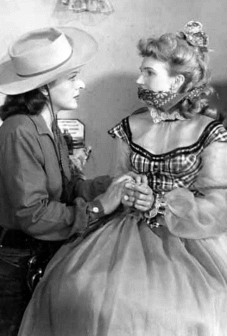 Evelyn Ankers as Calamity Jane and Grace Lee Whitney as Cecelia Mullen in The Texan Meets Calamity Jane (1950)