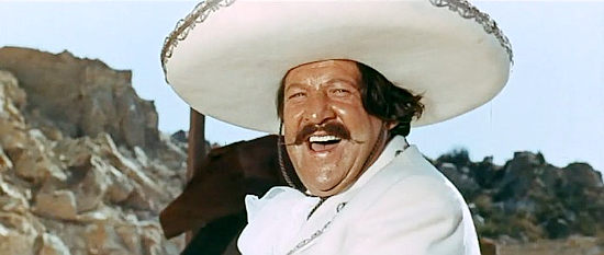 Fernando Sancho as Rodriguez, delighting in the evil deeds of his men in Seven Guns for Timothy (1966)