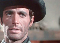 Gabriel Tinti as Jeff Tracy, confronting the man he thinks killed his father in Son of Django (1967)