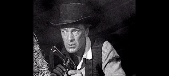 Gary Cooper as Marshal WIll Kane in the climatic shootout with Frank Miller and his men in High Noon (1952)
