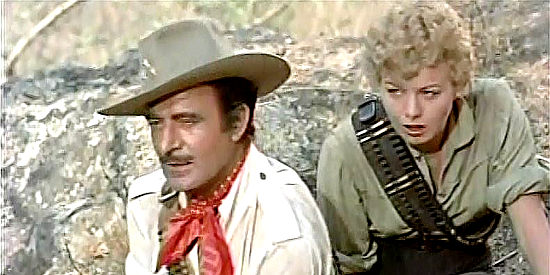 Gilbert Roland as Juan Castro and Shelley Winters as Ruth Harris, saved from the Mexican forces closing in on them in The Treasure of Pancho Villa (1955)