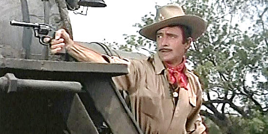 Gilbert Roland as Juan Castro, during an attack on a Mexican government gold train in The Treasure of Pancho Villa (1955)