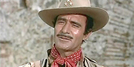Gilbert Roland as Juan Castro, the revoluntionary determined to deliver a fortune in gold to Pancho Villa in The Treasure of Pancho Villa (1955)