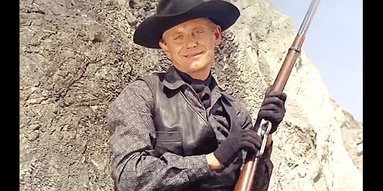 Horst Frank as Billy Clanton, intending to ambush a lawman in Bullets Don't Argue (1964)